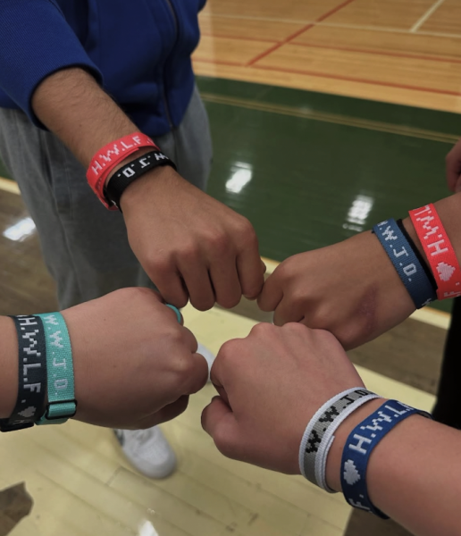 Members of the clubs posing with their WWJD bracelets (What Would Jesus Do)